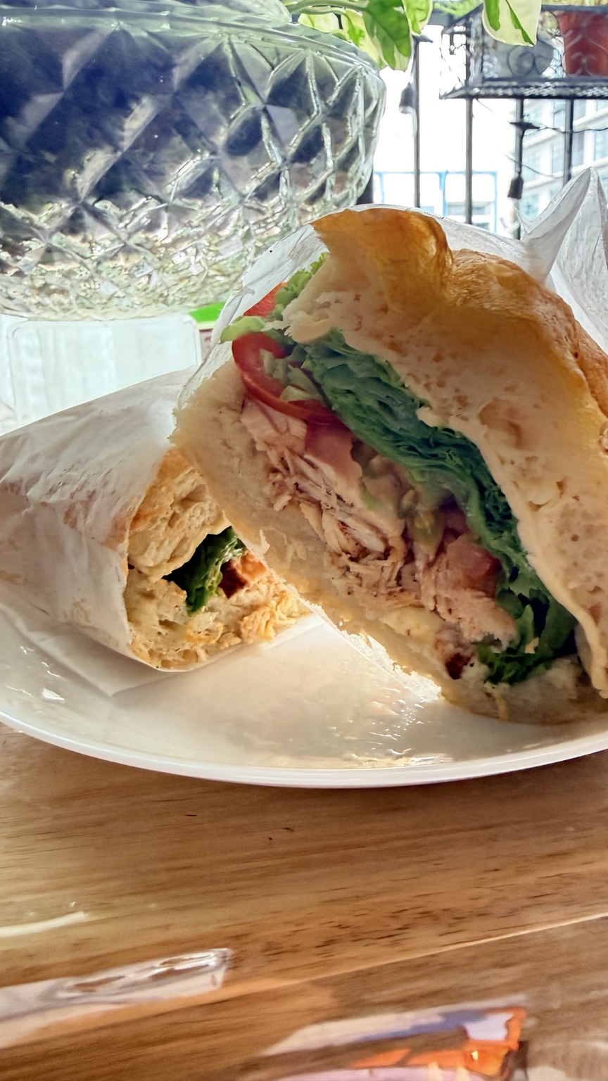 Homemade focaccia sandwich with chicken and fresh vegetables